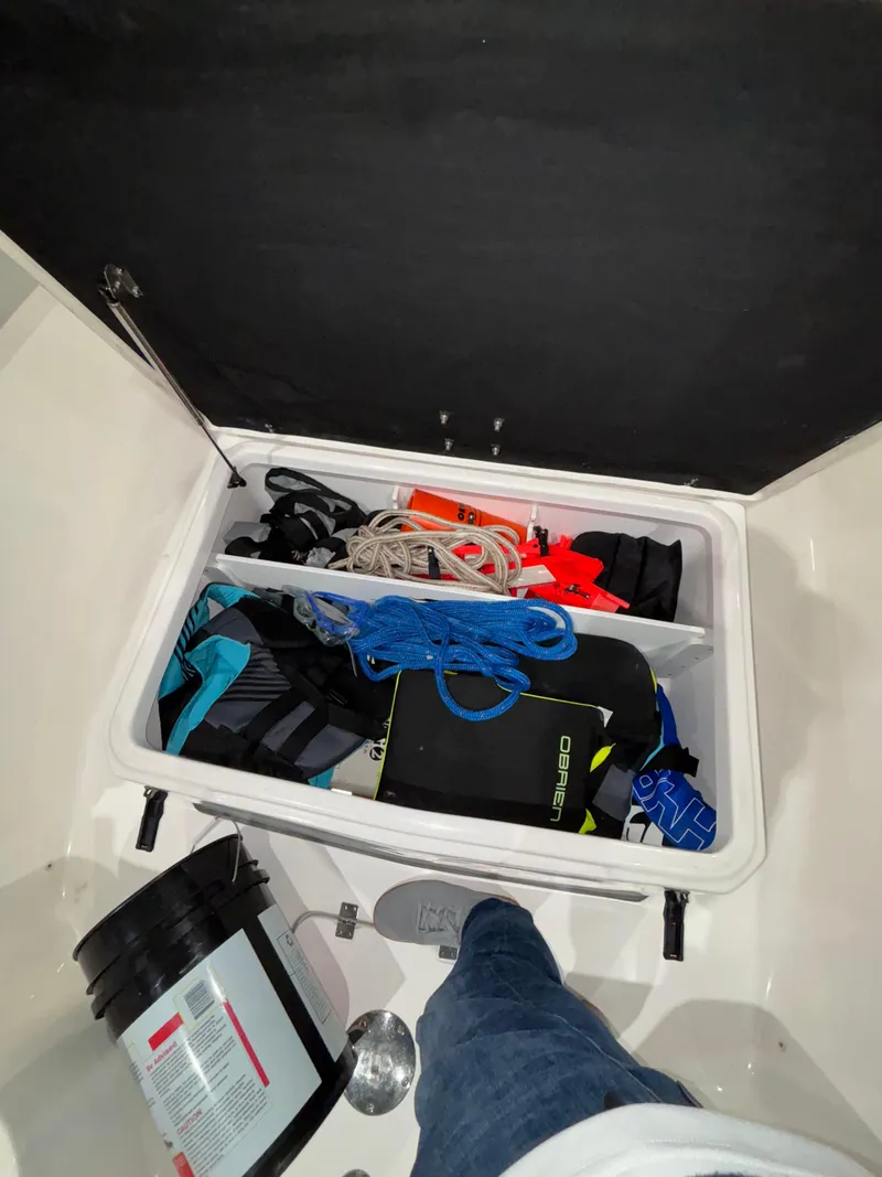 Slide: The Image of Storage compartment of 2020 Sea Fox 266 Commander boat with various equipment and supplies. - 19