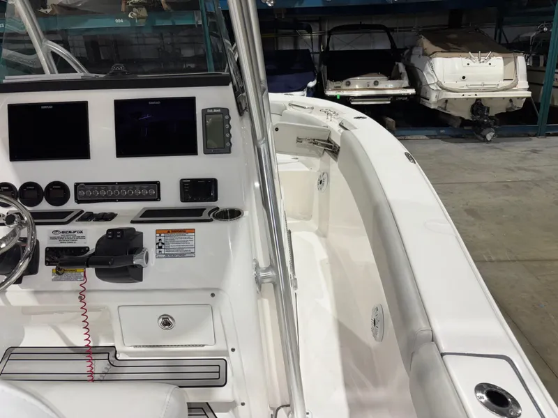 Slide: The Image of 2020 Sea Fox 266 Commander boat interior with control panel and seating. - 22