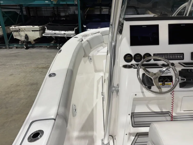 Slide: The Image of 2020 Sea Fox 266 Commander boat interior with steering wheel and control panel. - 23