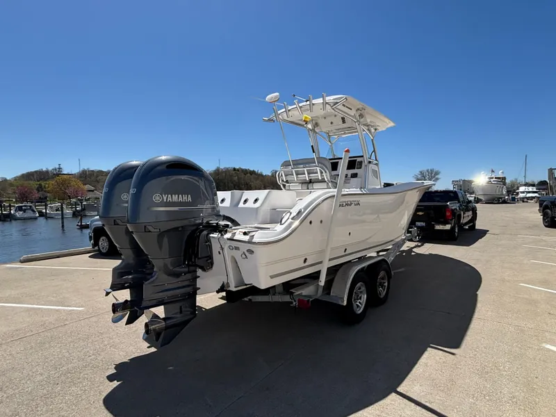 Slide: The Image of 2020 Sea Fox 266 Commander boat on trailer with Yamaha engines, parked near marina. - 3