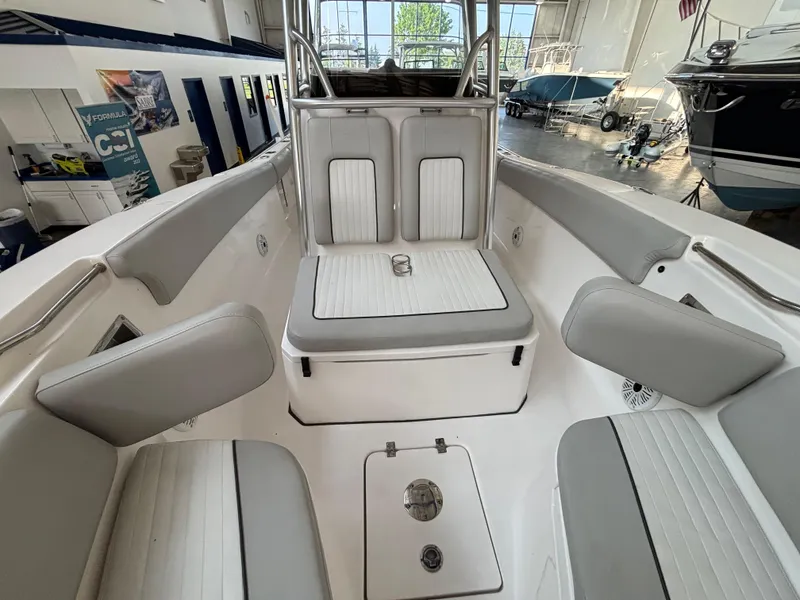 Slide: The Image of 2020 Sea Fox 266 Commander boat interior with gray and white seating in a showroom. - 5