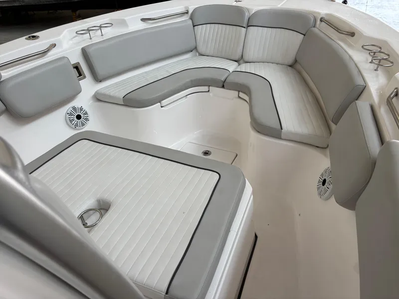 Slide: The Image of Interior seating of 2020 Sea Fox 266 Commander boat, featuring gray and white upholstery. - 6