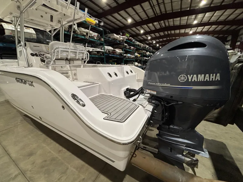 Slide: The Image of 2020 Sea Fox 266 Commander boat with Yamaha outboard engine in indoor storage. - 9