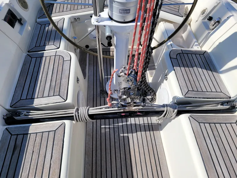 Slide: The Image of Cockpit of 2001 X-Yachts 332 sailboat with teak flooring and rigging details. - 13
