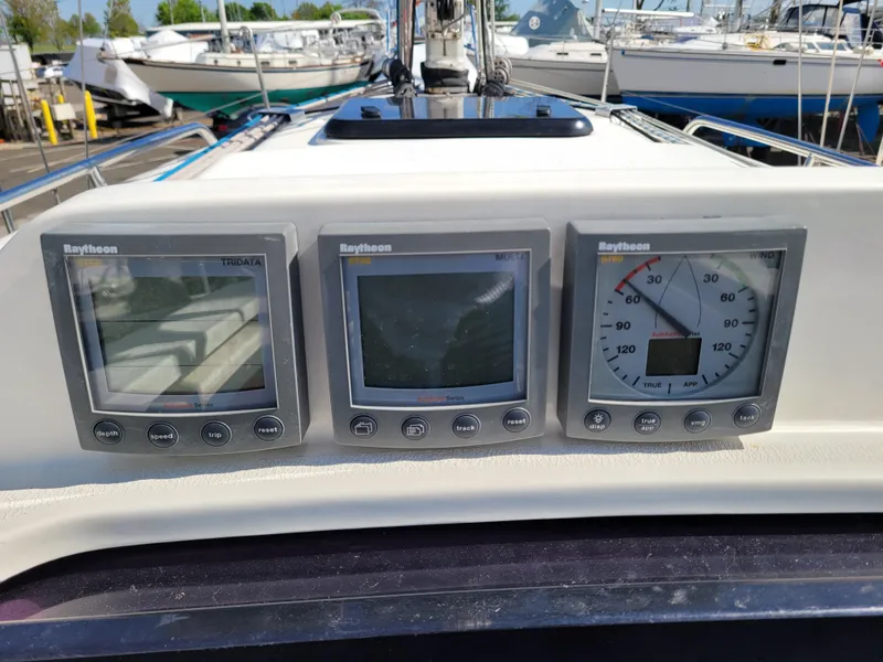 Slide: The Image of Raytheon navigation instruments on 2001 X-Yachts 332 sailboat dashboard. - 16