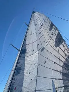 Slide: The Image of Sailing yacht X-Yachts 332, 2001 model, with sails unfurled against a clear blue sky. - 2