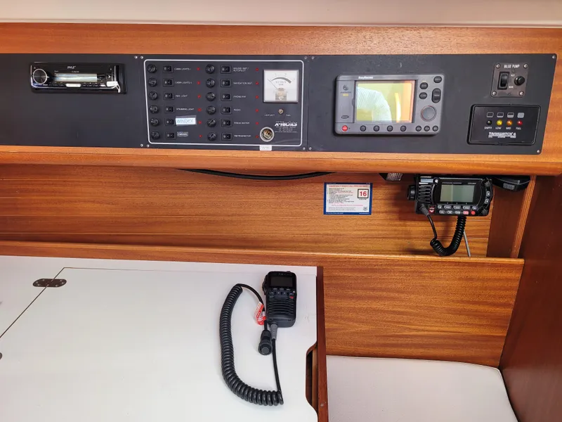 Slide: The Image of Control panel of a 2001 X-Yachts 332 sailboat, featuring navigation and communication equipment. - 20
