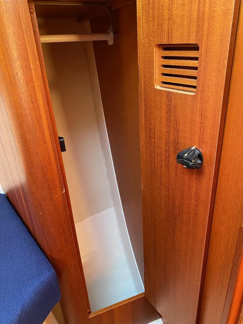 Slide: The Image of Wooden closet interior on a 2001 X-Yachts 332 sailboat. - 42