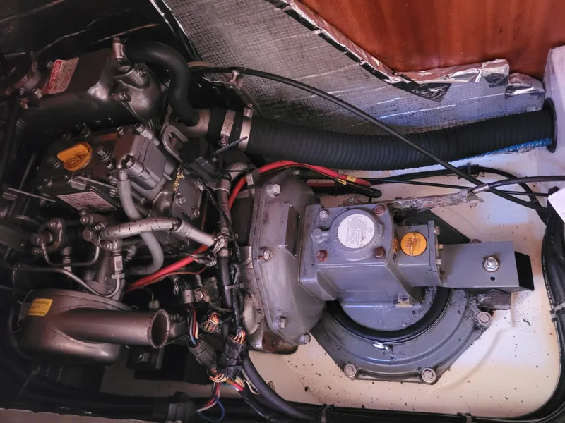 Slide: The Image of Engine compartment of a 2001 X-Yachts 332 sailboat, showcasing mechanical components and wiring. - 44