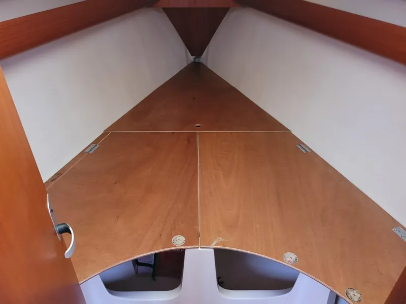 Slide: The Image of Interior view of 2001 X-Yachts 332 sailboat cabin with wooden finish. - 48