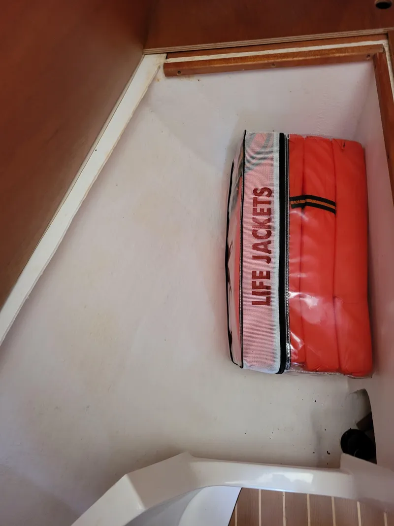 Slide: The Image of Life jackets stored in an X-Yachts 332, 2001 model, cabin compartment. - 51