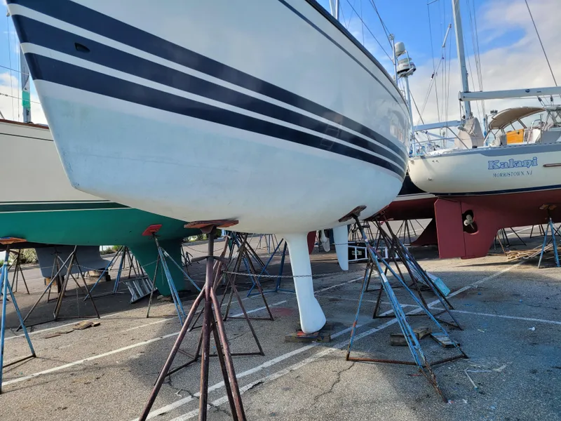Slide: The Image of 2001 X-Yachts 332 sailboat on stands in a boatyard, showing hull and keel. - 6