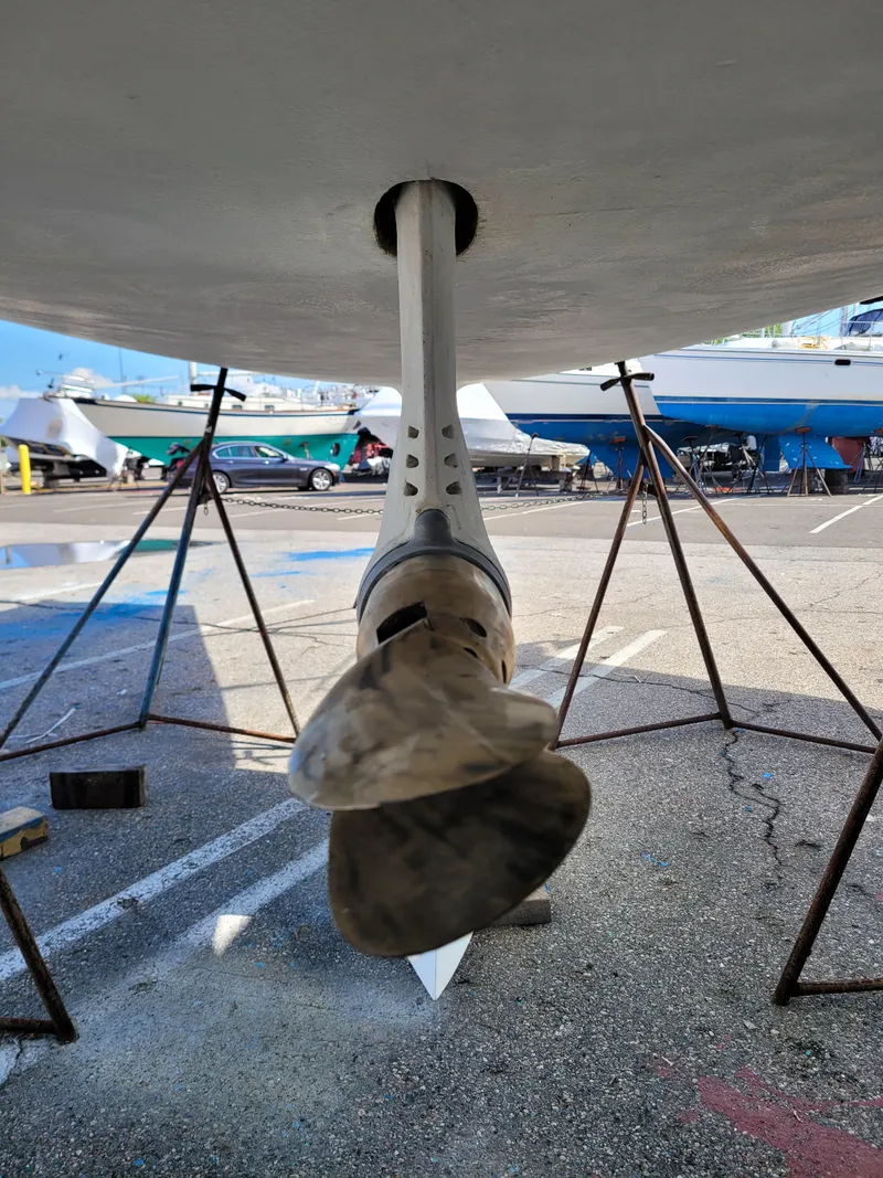 Slide: The Image of Propeller of 2001 X-Yachts 332 sailboat on dry dock, supported by stands. - 9