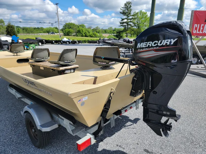 Slide: The Image of 2018 Lowe Roughneck 2070 Big River boat with Mercury outboard motor on trailer. - 1