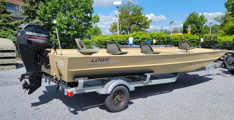 Slide: The Image of 2018 Lowe Roughneck 2070 Big River boat on trailer with Mercury outboard motor. - 3