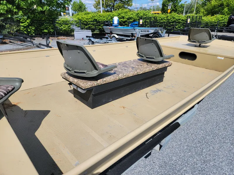 Slide: The Image of 2018 Lowe Roughneck 2070 Big River boat interior with seating and storage. - 5