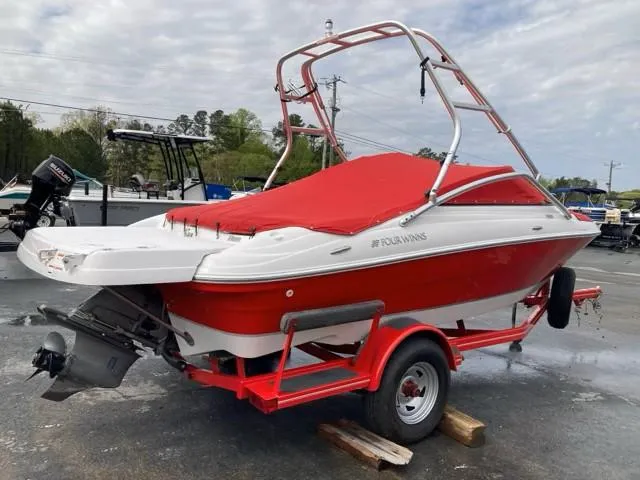 Slide: The Image of 2010 Four Winns H190 boat with red cover on a matching trailer. - 14