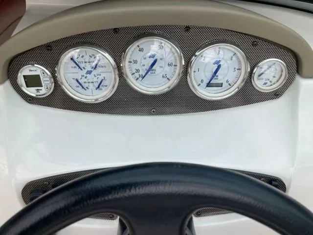 Slide: The Image of Dashboard of 2010 Four Winns H190 boat with gauges and steering wheel. - 20