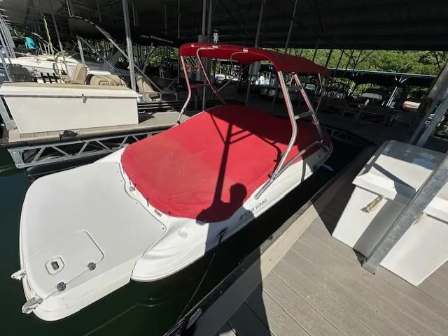 Slide: The Image of 2010 Four Winns H190 boat with red cover docked in marina. - 7