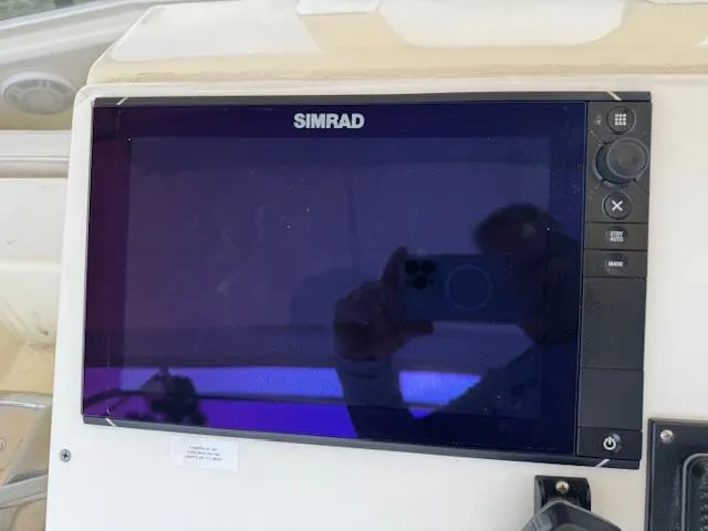 Slide: The Image of Simrad display on 1989 Egg Harbor 35 Sport Fisherman boat dashboard. - 15