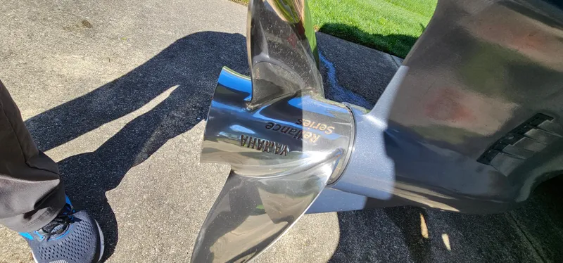 Slide: The Image of Propeller of a 2017 Cobia 277 Center Console boat on concrete surface. - 13