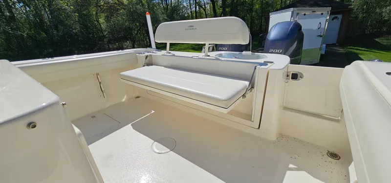 Slide: The Image of 2017 Cobia 277 Center Console boat with foldable seating and Yamaha outboard motor. - 17