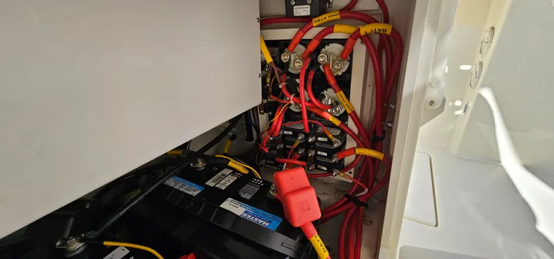Slide: The Image of Electrical wiring and battery setup in a 2017 Cobia 277 Center Console boat. - 33