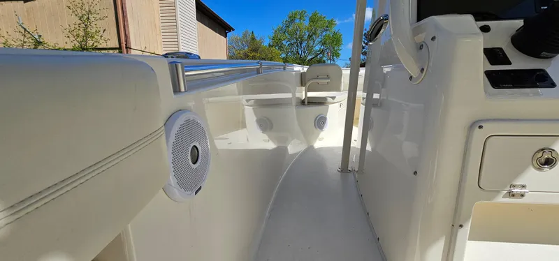 Slide: The Image of 2017 Cobia 277 Center Console boat interior with speakers and sleek design. - 36