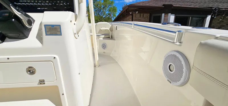 Slide: The Image of 2017 Cobia 277 Center Console boat interior with speakers and control panel. - 37