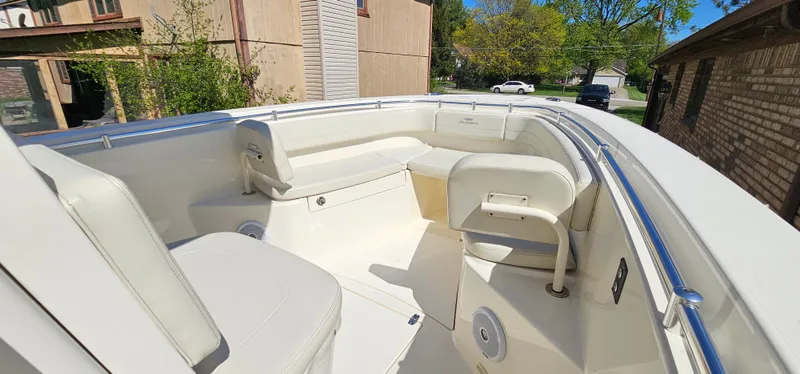 Slide: The Image of 2017 Cobia 277 Center Console boat with spacious seating and sleek design. - 38