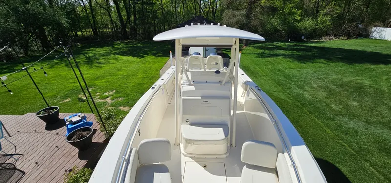 Slide: The Image of 2017 Cobia 277 Center Console boat on grassy lawn, viewed from above. - 41