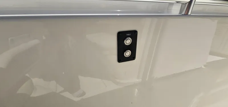 Slide: The Image of 2017 Cobia 277 Center Console boat with dual button panel on the side. - 47