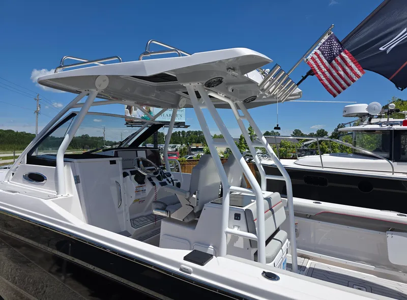 Slide: The Image of 2025 Solara S-250 CW boat with American flag, sleek design, and modern cockpit. - 11