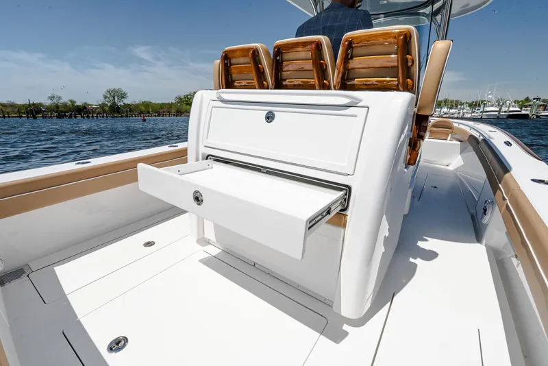 Slide: The Image of 2025 Valhalla V-29 Hybrid boat with open storage drawer on deck. - 14