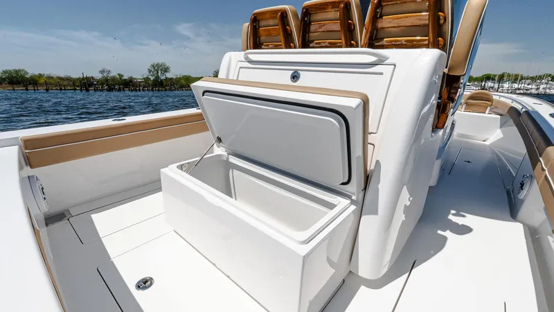 Slide: The Image of 2025 Valhalla Boatworks V-29 Hybrid with open storage compartment, luxurious seating, and sleek design. - 16