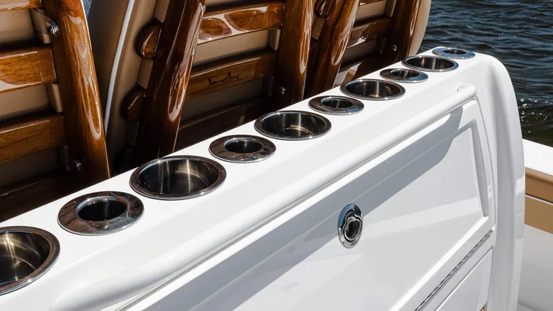 Slide: The Image of 2025 Valhalla Boatworks V-29 Hybrid, featuring sleek cup holders and polished wood accents. - 18