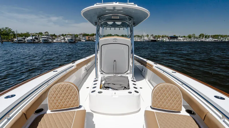 Slide: The Image of 2025 Valhalla Boatworks V-29 Hybrid on water, featuring spacious deck and seating. - 34