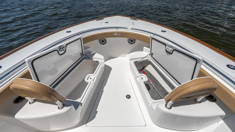 Slide: The Image of 2025 Valhalla Boatworks V-29 Hybrid bow with open storage compartments on the water. - 37