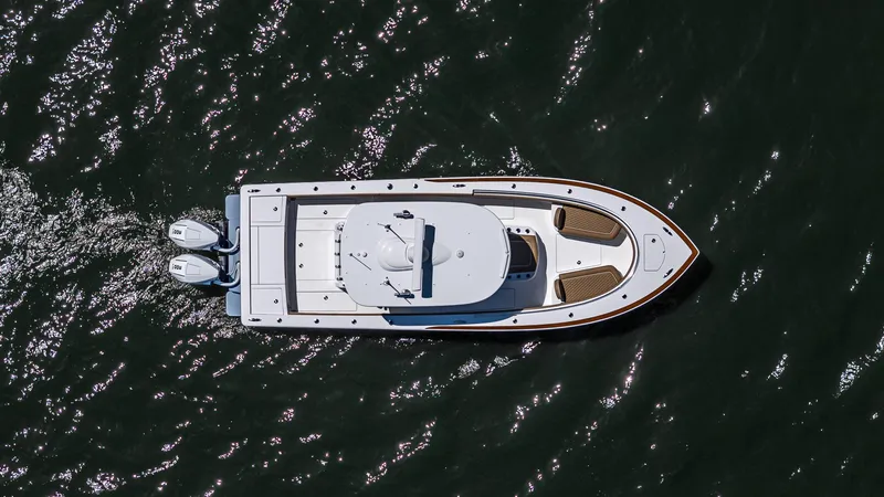 Slide: The Image of 2025 Valhalla Boatworks V-29 Hybrid cruising on water, aerial view. - 39