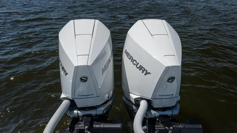 Slide: The Image of Twin Mercury outboard engines on a 2025 Valhalla Boatworks V-29 Hybrid. - 6