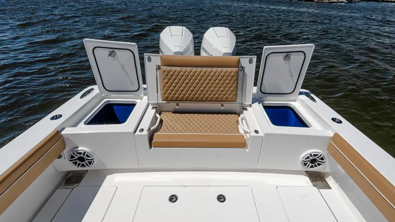 Slide: The Image of 2025 Valhalla Boatworks V-29 Hybrid with open storage compartments and cushioned seating. - 9
