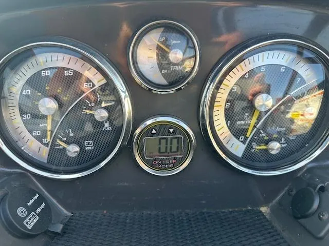 Slide: The Image of Dashboard of a 2021 Bayliner VR5 Bowrider I/O with speedometer and fuel gauges. - 11