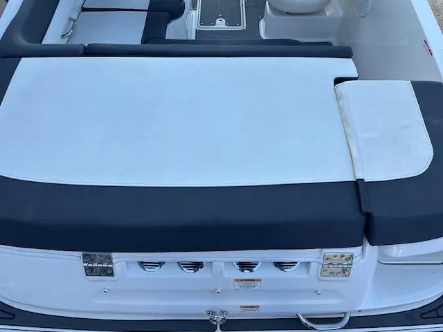 Slide: The Image of 2021 Bayliner VR5 Bowrider I/O boat interior with cushioned seating and sleek design. - 12