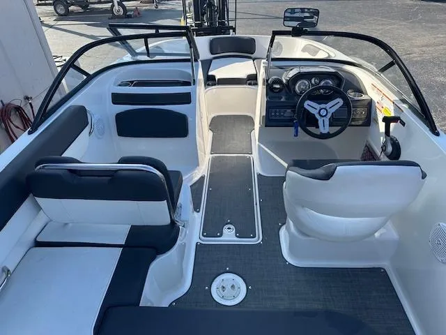 Slide: The Image of 2021 Bayliner VR5 Bowrider I/O interior with seating and steering wheel. - 6