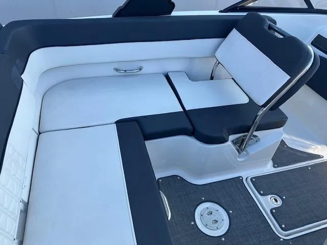 Slide: The Image of 2021 Bayliner VR5 Bowrider I/O interior seating with white and black upholstery. - 7
