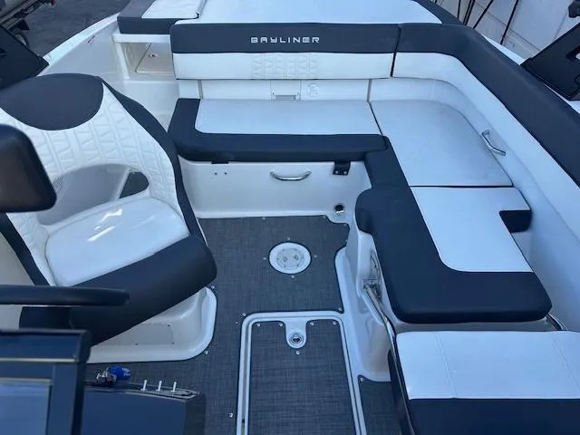 Slide: The Image of 2021 Bayliner VR5 Bowrider I/O interior with white and black seating, modern design. - 8