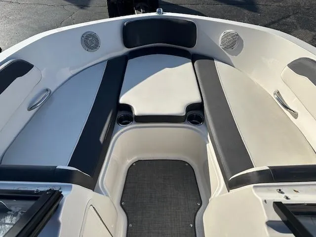 Slide: The Image of 2021 Bayliner VR5 Bowrider I/O interior with cushioned seating and cup holders. - 9