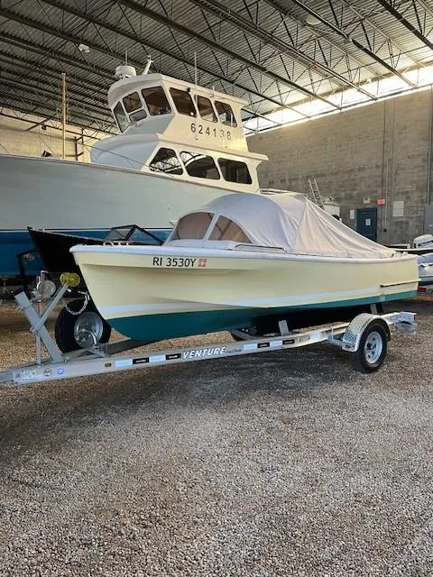 Slide: The Image of A person in an orange jacket on a 2023 Dyer Glamour Girl boat with an American flag. - 3