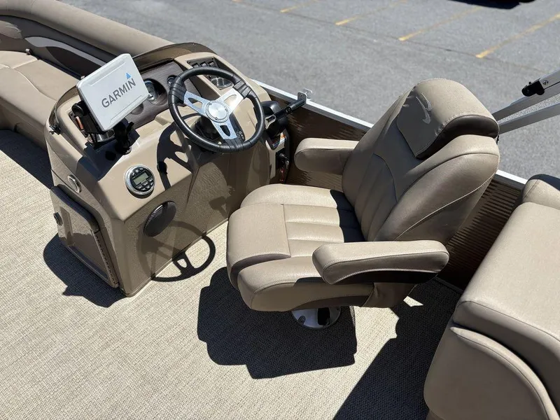 Slide: The Image of 2019 Bennington 23 SSRCX boat interior with Garmin navigation and plush captain's chair. - 13