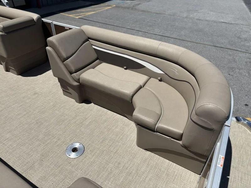 Slide: The Image of 2019 Bennington 23 SSRCX pontoon boat with beige seating and carpeted deck. - 14